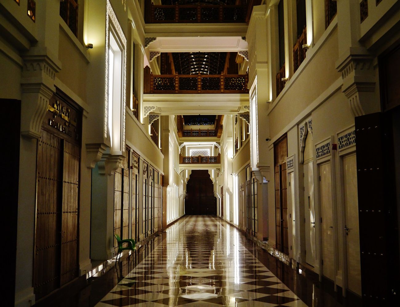 The arcade at night, lanterns and columns